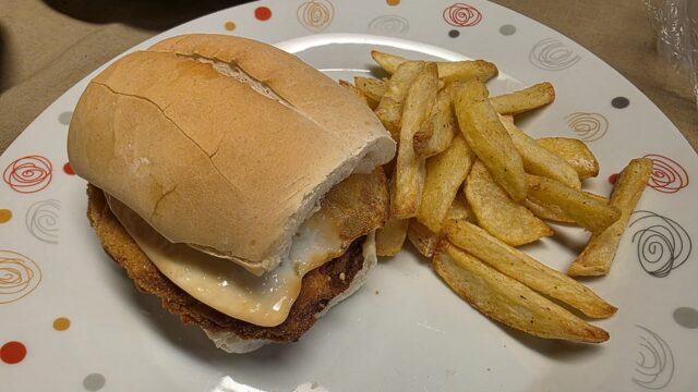 A chicken sandwich with french fries; an illustration, not taken at Birdie.