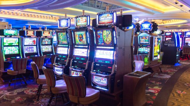 Rows of slot machines on a casino floor in Las Vegas; an illustration, not taken at Elbow River Casino.