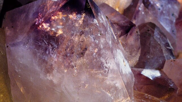 Amethyst and quartz crystals in a rock and mineral shop; an illustration, not taken at Rite of Ritual.