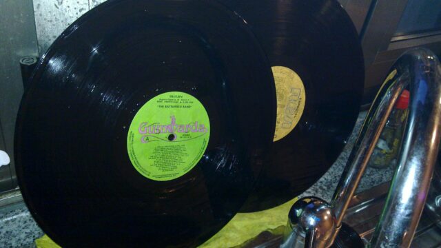 Vinyl LP records laid out to be cleaned; an illustration, not taken at Semantics Cafe.