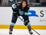 Calgary Flames and Seattle Kraken players in action during an NHL game in Seattle on November 20 2023.