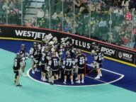 Calgary Roughnecks players crowding around the net before a preseason lacrosse game at the Scotiabank Saddledome on November 26 2022.