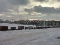 A snow-dusted Stampede Park lot under a grey winter sky in Calgary, March 2017.