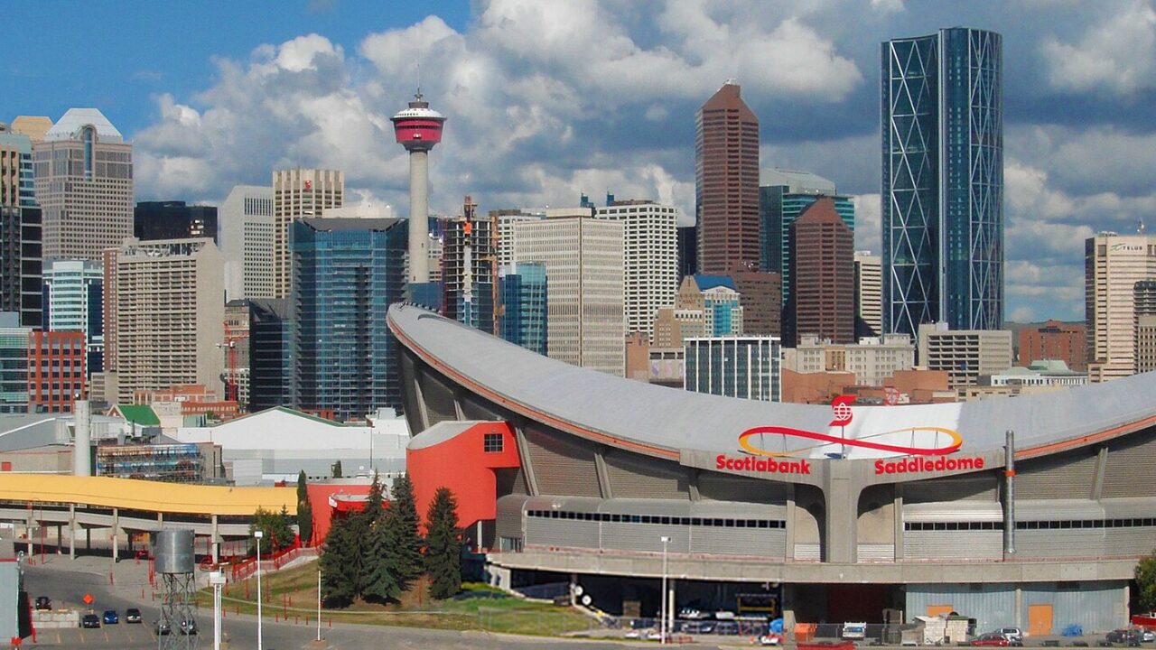 The downtown Calgary skyline with the Saddledome in front, photographed in September 2012.