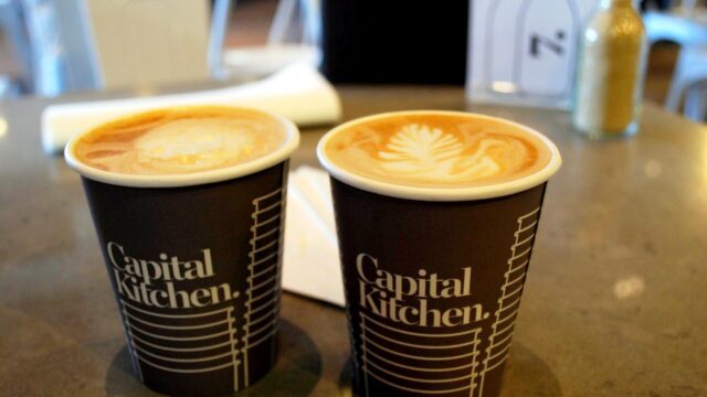 Two caffe lattes with latte art; an illustration, not taken at ZCREW Cafe.